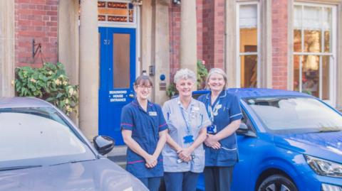 Beaumond House Hospice Care staff stood outside their headquarters, a large Victorian building in Newark