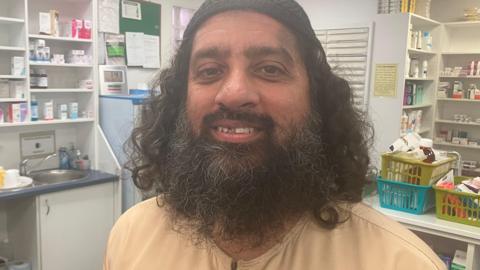Moin Kolia in a pharmacy