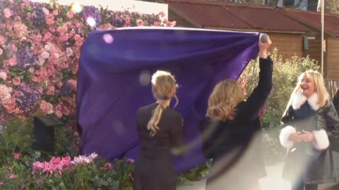 Bridget Jones statue under purple blanket