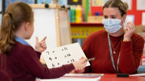 A primary school pupil learning