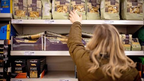 Woman at a Sainsbury's store