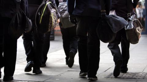 children heading to school