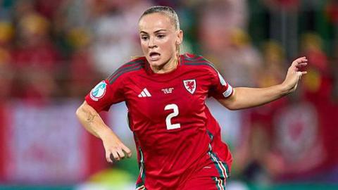 Lily Woodham in action for Wales at Euro 2025