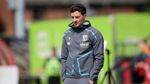 A photo of West Bromwich Albion boss Ryan Mason in the team's jacket