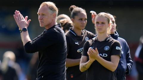 Manchester City boss Andree Jeglertz and Kerstin Casparij applauding after the defeat by Brighton