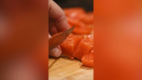 Salmone sliced with a knife