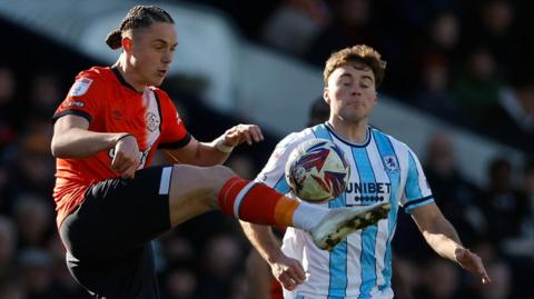 Luton Town's Thelo Aasgaard competes with Aidan Morris of Middlesbrough in the Championship match at Kenilworth Road