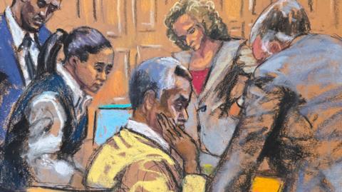 A court sketch of lawyers talking to Sean "Diddy" Combs 