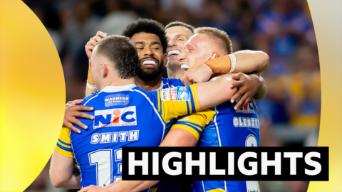 Leeds' Mikolaj Oledzki celebrates scoring a try against Leigh