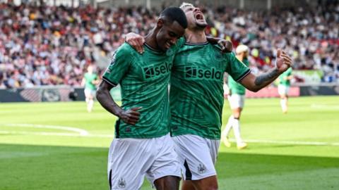 Alexander Isak and Bruno Guimaraes celebrate during Newcastle's Premier League victory at Brentford