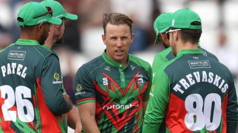 Logan van Beek of Leicestershire Foxes celebrates taking a wicket with team-mates