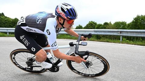 Tom Pidcock takes a corner on his bike