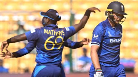 Sri Lanka's Angelo Mathews celebrates the dismissal of England's Joe Root in an ODI in 2023