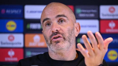 Enzo Maresca gestures during a news conference