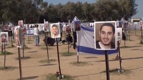 Posters showing pictures of people killed or kidnapped by Hamas at the Nova Music Festival site on October 7 2023.