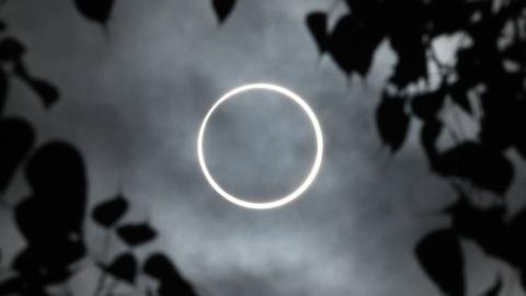 The moon totally covers the sun in a rare "ring of fire" solar eclipse in India