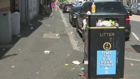 Bins overflowing with litter