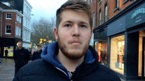 Man standing on the street in Norwich