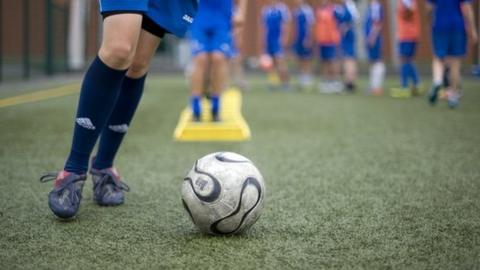 Youth footballers practising