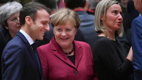 French President Macron and German Chancellor Merkel speak at an EU summit