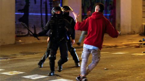 Police confront a protester in Barcelona, October 1 2018