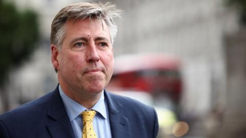 Chairman of the 1922 Committee Graham Brady walks on Whitehall, in London,