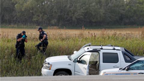 Police take photos of the crime scene