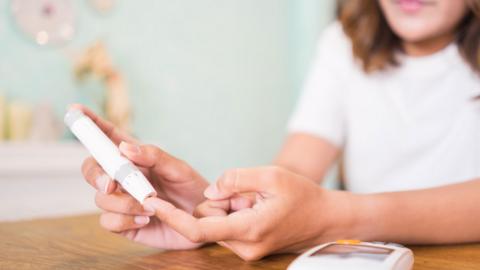 A person checking their blood sugar levels