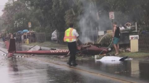 Residents used garden hoses to try to extinguish the blazing helicopter