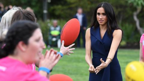 Meghan playing Aussie Rules football