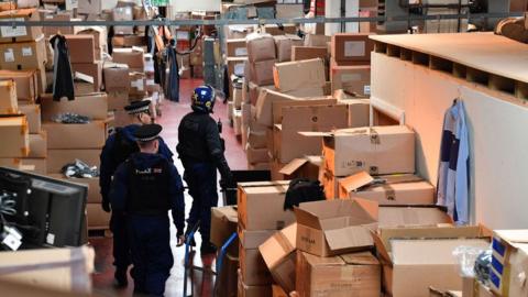 Police enter warehouse