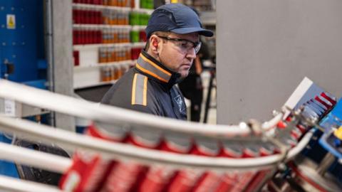 Man working in a soft drinks production facility