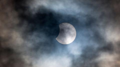 A rare partial solar eclipse is seen at 10.23 over Burford on March 20, 2015 in the Cotswolds, United Kingdom