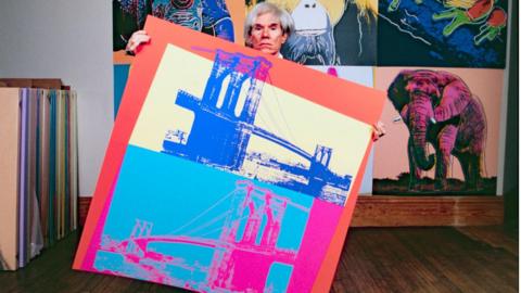 American pop artist Andy Warhol in his studio in New York in 1983.