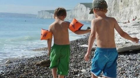 Two children playing on a beach