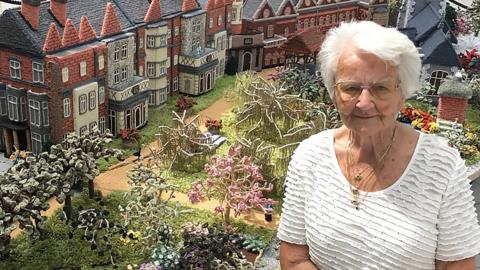 Margaret Seaman with her knitted version of Sandringham House