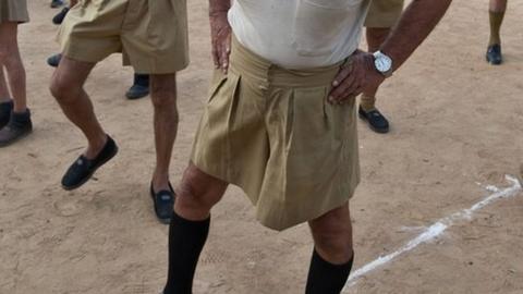 Indian senior swayamsevaks, or volunteers, from the Rashtriya Swayamsevak Sangh (RSS), the country's biggest grassroots religious group, excercise during the Shakha