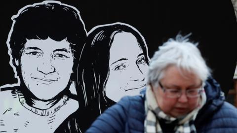 Placard shows murder victims in Bratislava, 21 Feb 20