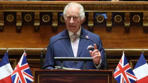 King Charles giving a speech in the Frenche Senate