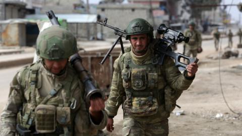 Turkish troops patrol the town of Atareb in Aleppo province, Syria (19 February 2020)