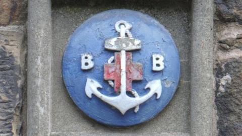 BB crest on a wall