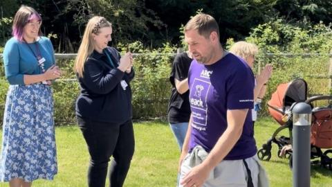 Grant Holt completing a charity walk