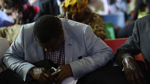 Faithfuls praying in church