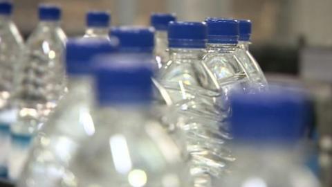 Plastic bottles on factory conveyer