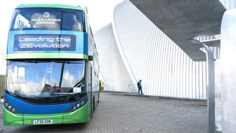 A bus demonstrating battery electric and hydrogen fuel cell technology is displayed at COP26