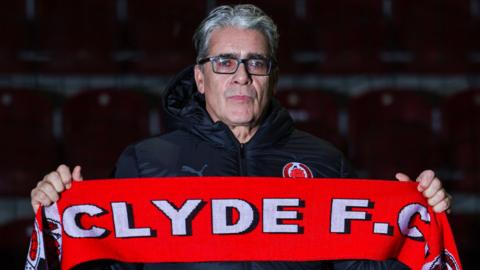 Clyde manager Ian McCall with a club scarf