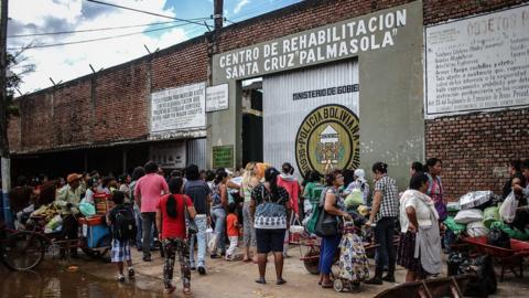 1: Visitors, mainly family members, wait in line to visit prisoners inside Palmasola prison a day after Pope Francis' visit on July 11, 2015 in Santa Cruz, Bolivia