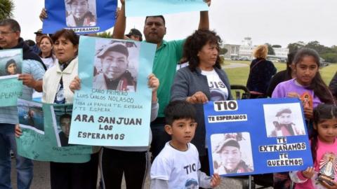 Relatives of Luis Carlos Nolasco, one of the 44 crew members of the missing at sea ARA San Juan submarine, at an Argentine naval base in Mar del Plata, Argentina December 3, 2017