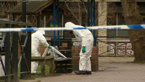 Investigators in white suits in Salisbury