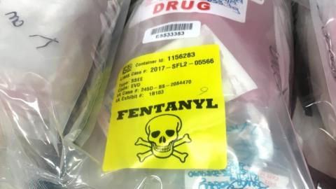 Bags of drugs are displayed on a table during a press conference held by the US Attorney's Office in Boston, 23 August 2018